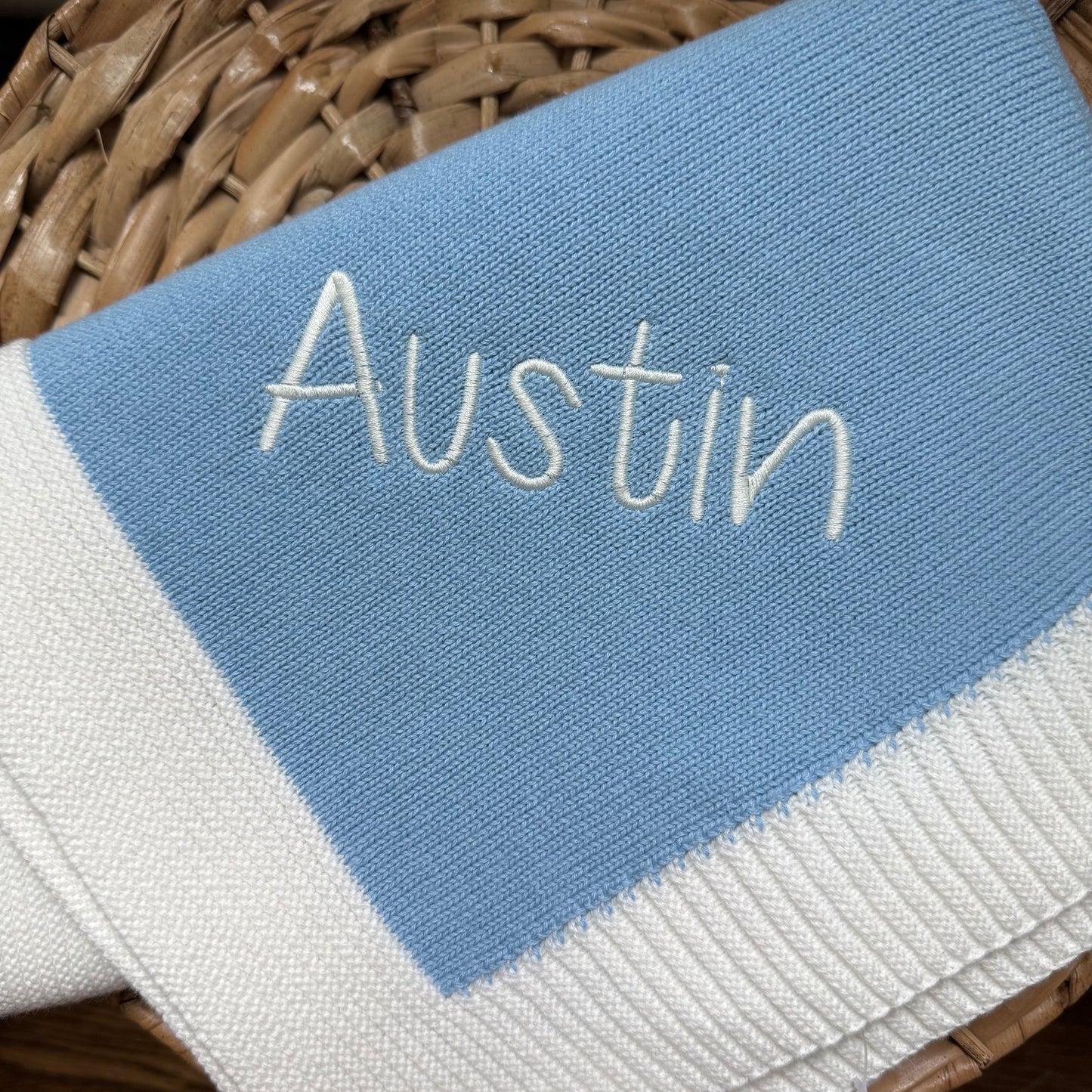 Jersey knit blanket with ribbed border